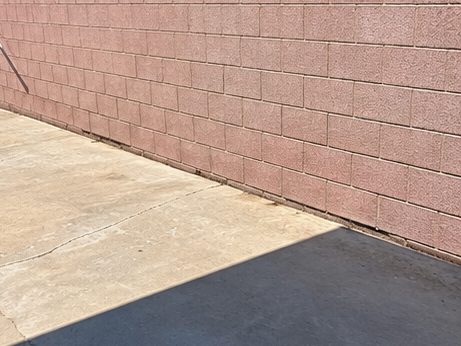 The same spot along the wall, cleared and empty